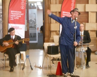 Greg Poppleton 1920s - 1930s singer at the Transport Expo. Grahame Conlon guitar and Adam Barnard drums and washboard.